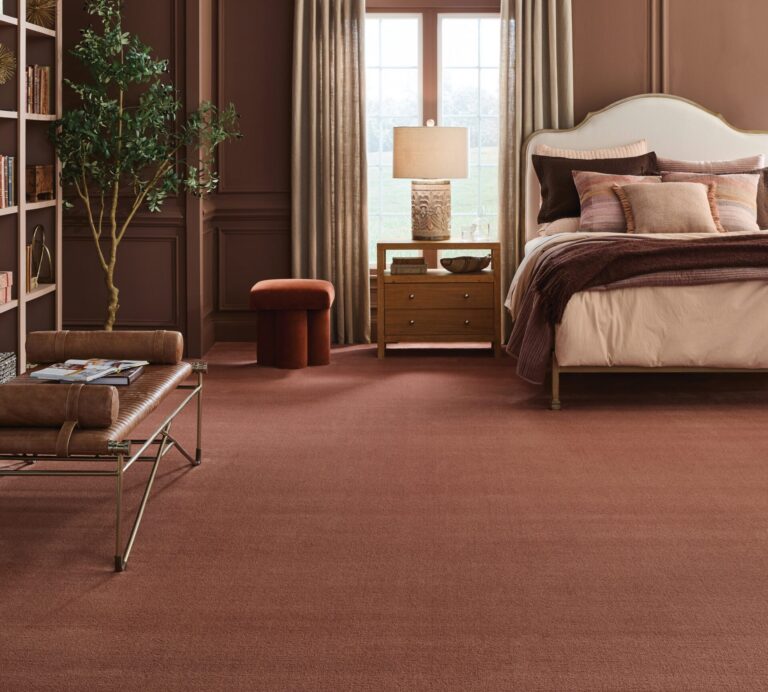 Bedroom with warm rust-colored Fabrica carpet